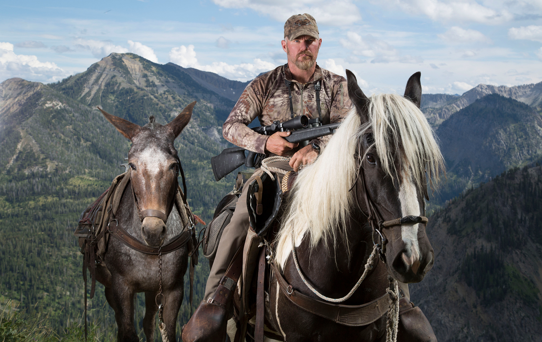 Man on horse with rifle